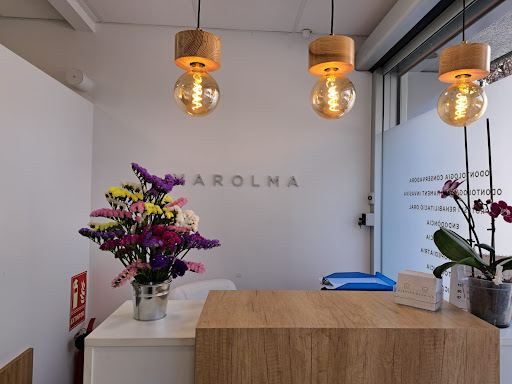 Clinica Dental MAROLMA logo